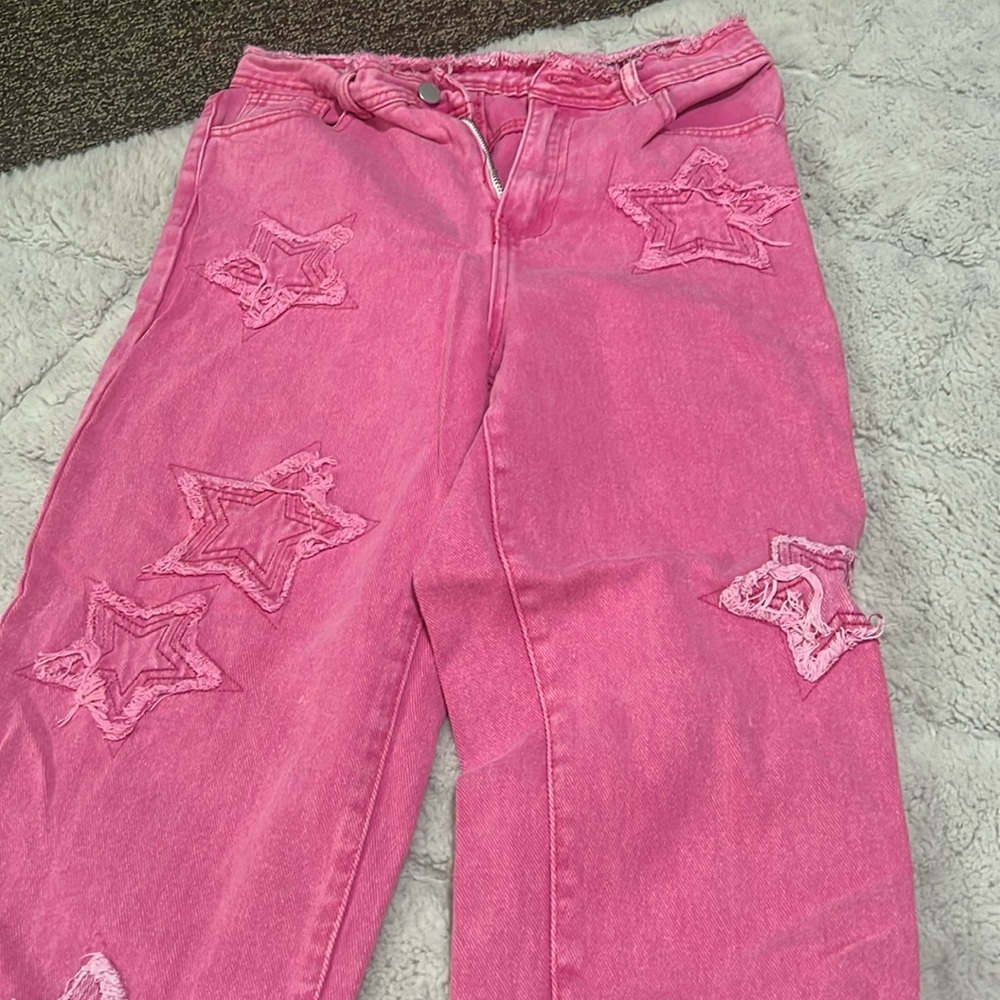 pink jeans with stars on them